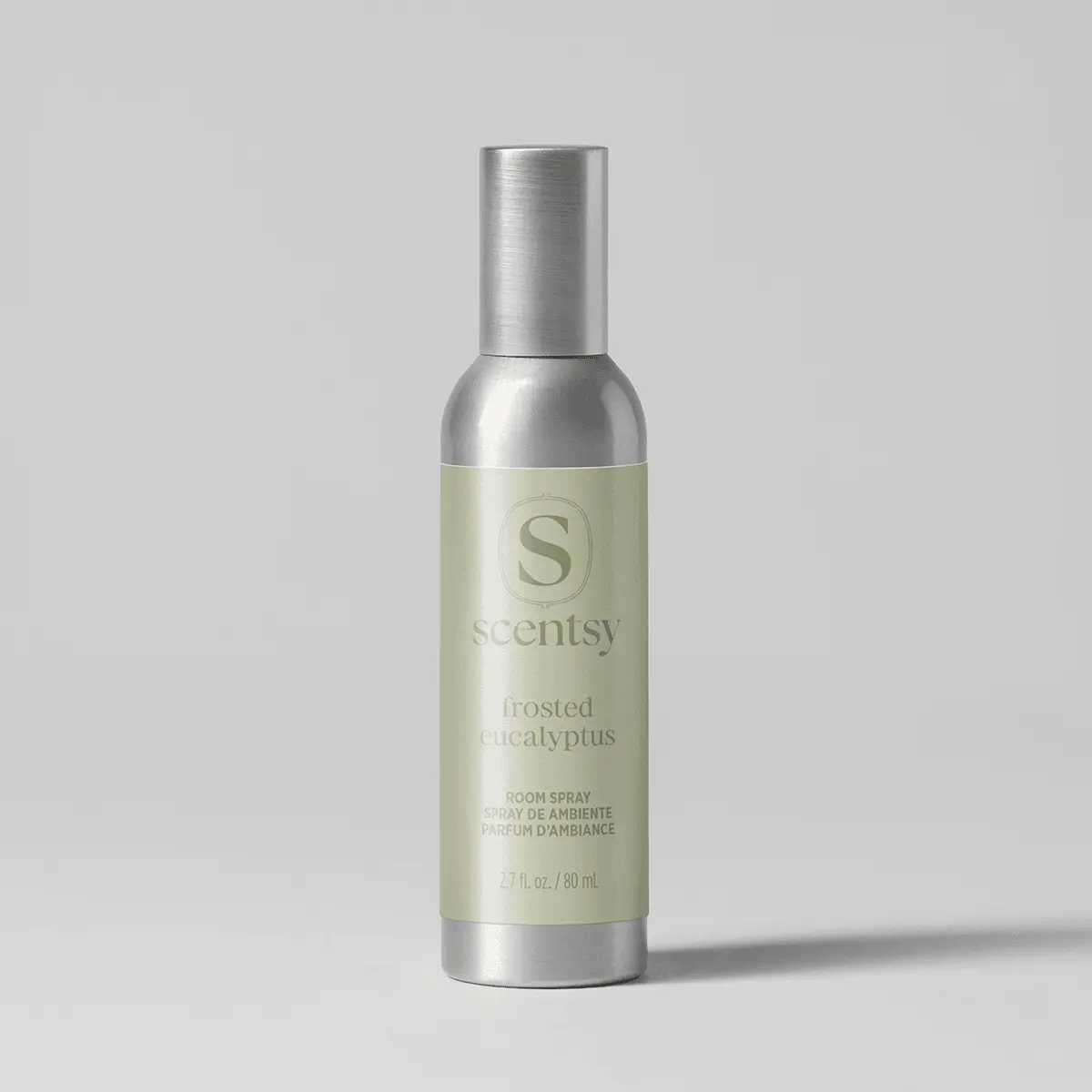 Pale green and silver cylindrical room spray bottle labelled Frosted Eucalyptus Room Spray, 80 ml, with metallic cap and label band