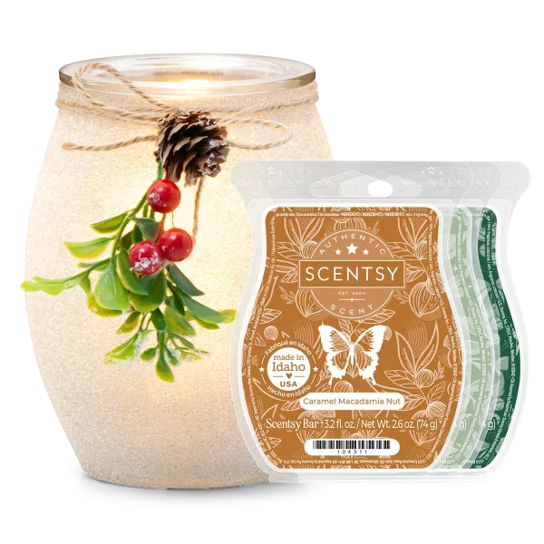 Frosted Mistletoe Scentsy Warmer Bundle with a textured cream ceramic warmer decorated with evergreen sprigs, red berries, and a pinecone tied with twine, alongside a brown Caramel Macadamia Nut Scentsy Bar