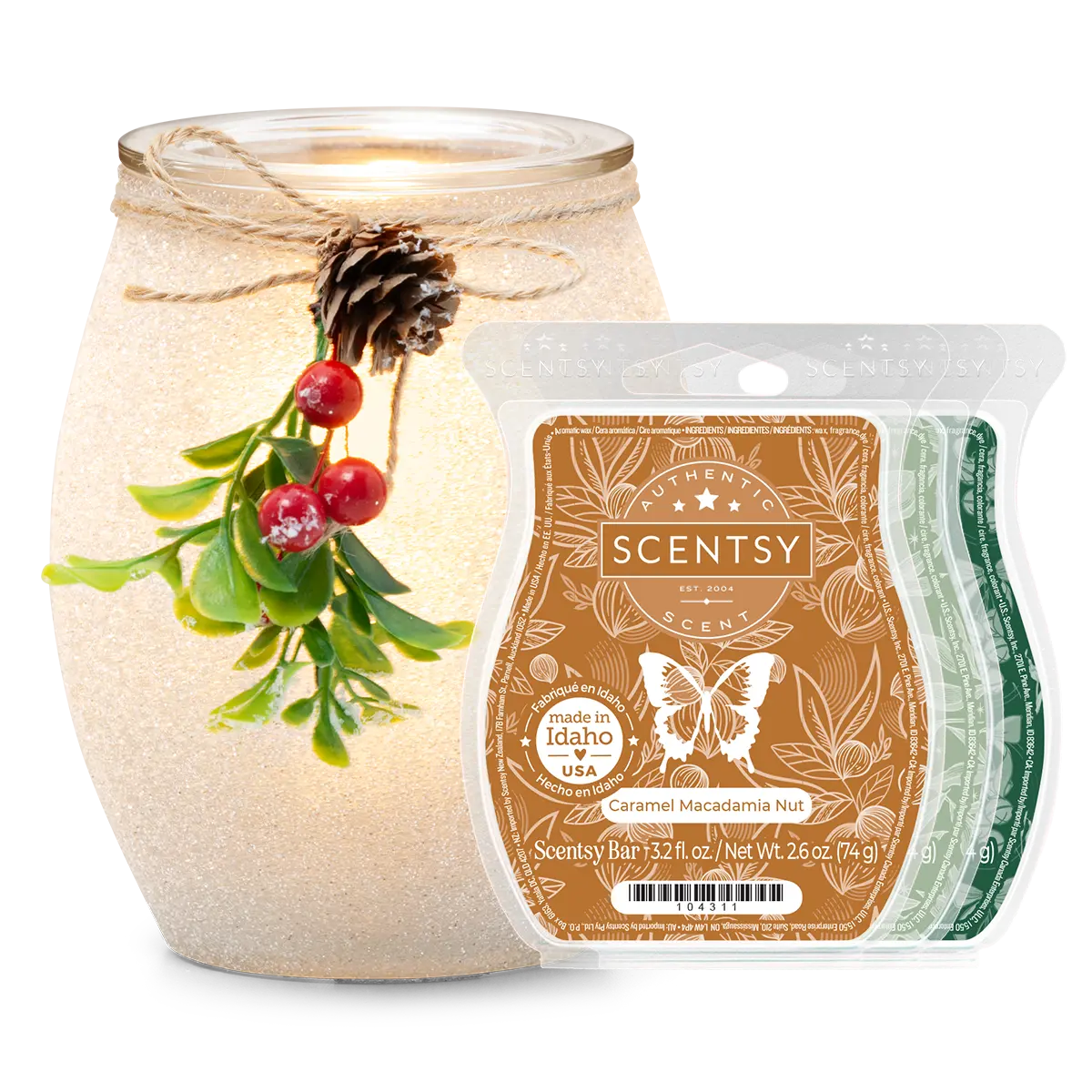 Frosted Mistletoe Scentsy Warmer Bundle with a textured cream ceramic warmer decorated with evergreen sprigs, red berries, and a pinecone tied with twine, alongside a brown Caramel Macadamia Nut Scentsy Bar