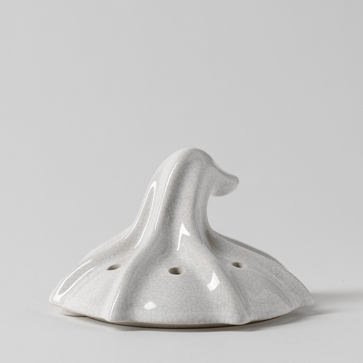 White crackle-glaze ceramic lid shaped like a gourd top with a curled stem and small vent holes, the Ghostlight Gourd Replacement Lid