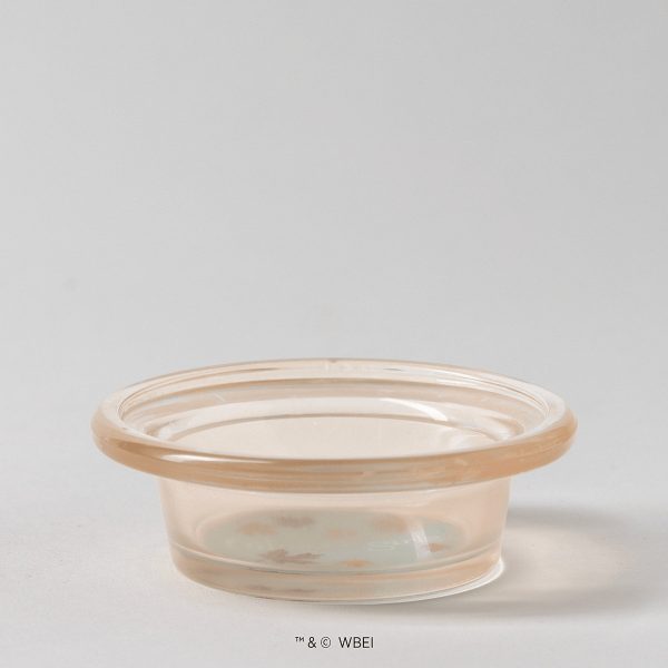 Translucent peach-tinted glass warmer dish with a rolled rim and a pale blue base scattered with small leaf shapes, the Gilmore Girls: Welcome to Stars Hollow Replacement Dish