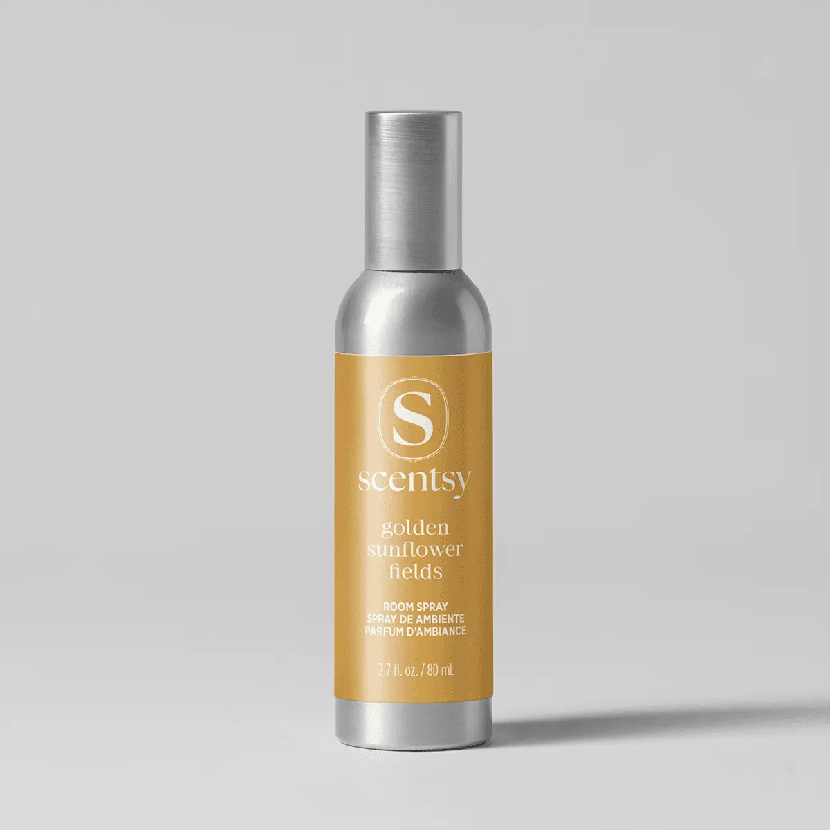 Metallic silver bottle with a gold label featuring the Scentsy logo and text reading "Golden Sunflower Fields Room Spray", 2.7 fl. oz. / 80 mL