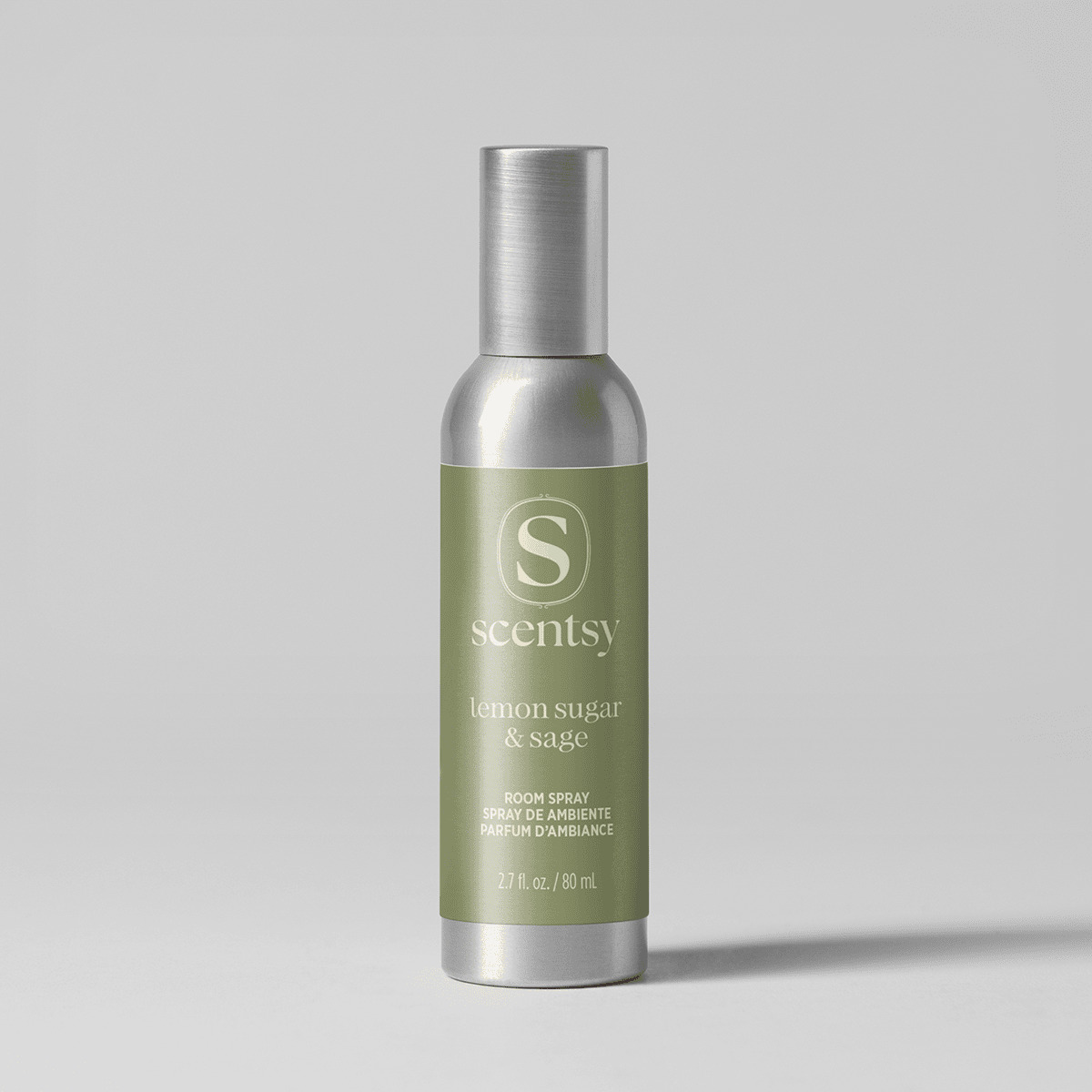 Cylindrical room spray bottle with a brushed silver cap and base, sage-green label with cream text reading Scentsy lemon sugar & sage, 2.7 fl. oz./80 ml, Lemon Sugar & Sage Room Spray