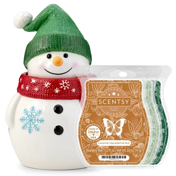 Ceramic snowman warmer with a green knit hat, orange carrot nose, black button eyes, red scarf with snowflakes, and blue snowflake detail on body, displayed with Caramel Macadamia Nut Scentsy wax bars, the Looks Like Snow Scentsy Warmer Bundle