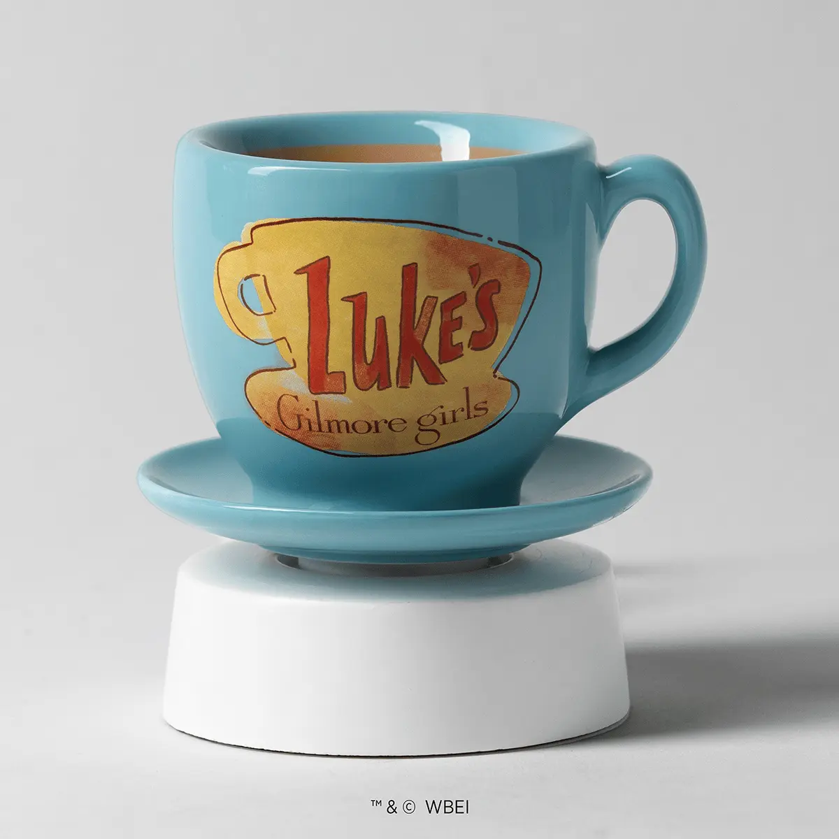Turquoise ceramic mug warmer with Luke's Diner logo and matching saucer base on white pedestal, the Luke's Coffee Mug Mini Scentsy Warmer