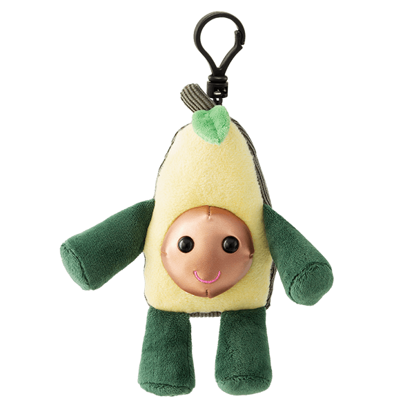 Plush avocado toy with a yellow body, green arms and legs, smiling copper face and black clip, the Lula the Avocado Scentsy Buddy Clip