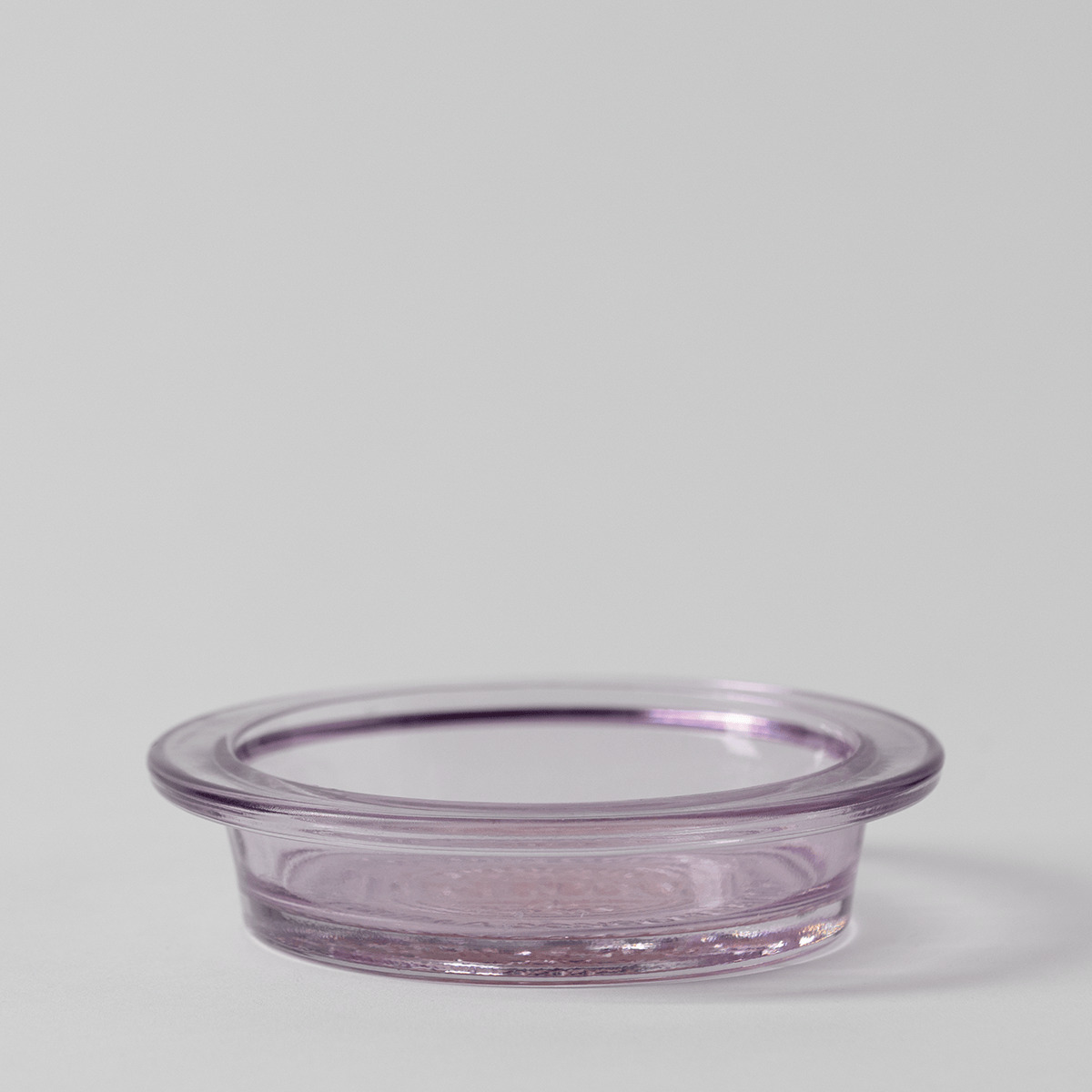 Shallow round lavender-tinted glass dish with a wide flat rim on a pale grey background, the Nightfall Replacement Dish