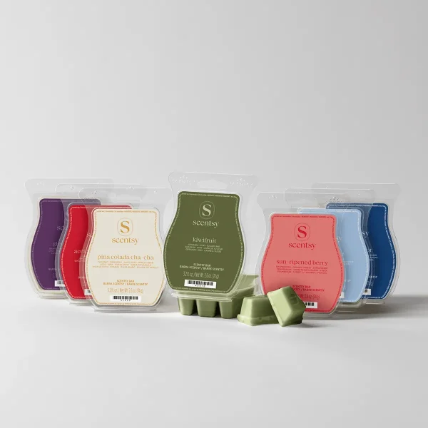 Eight Scentsy Bar clamshell packs in purple, red, cream, olive green, coral and blue, with loose green wax cubes, the November Bring Back My Bar Bundle