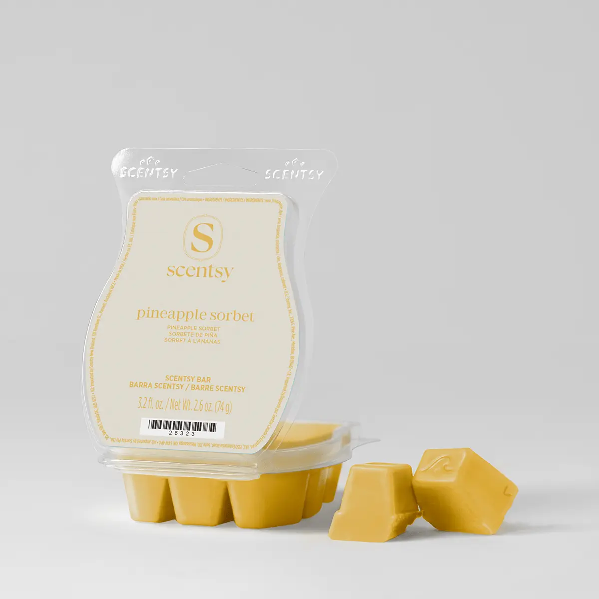 Pale yellow wax melts in a clear clamshell package labelled pineapple sorbet, with several individual wax cubes displayed in front