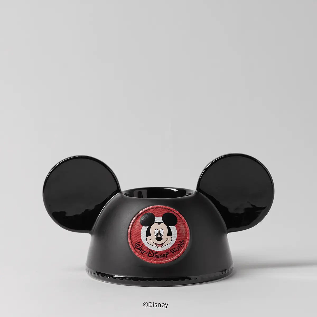 Black ceramic warmer with prominent rounded ears and an embroidered red circular patch of Mickey Mouse with "Walt Disney World" text, the Walt Disney World: Embroidered Mickey Ears Scentsy Warmer