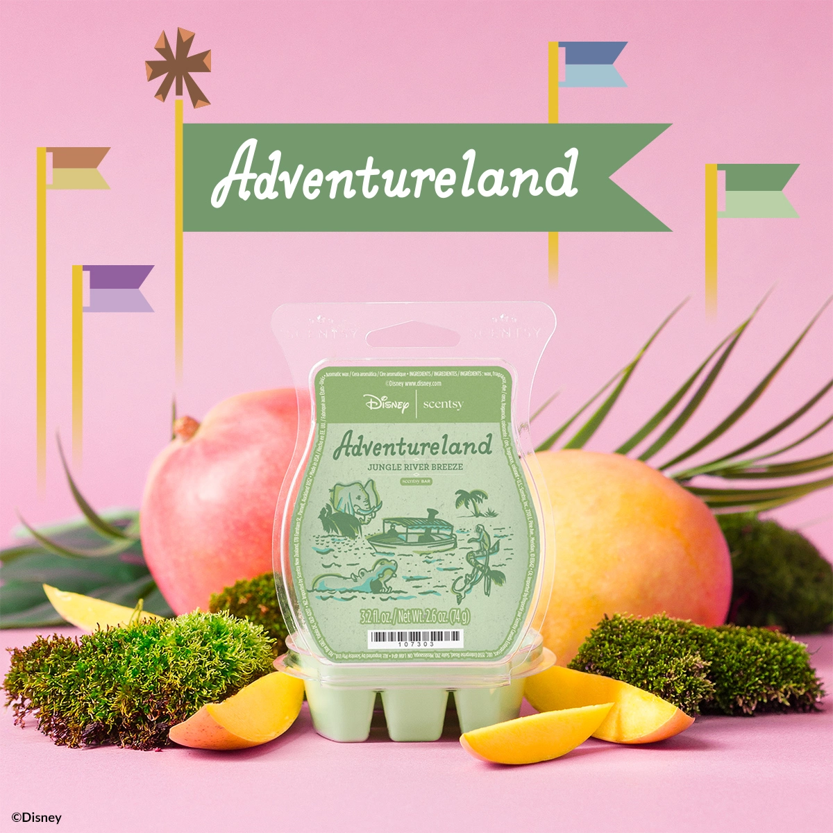 Scentsy Wax bar in pale green, packaged with Disney branding, displayed on moss amongst coral and yellow decorative fruit, palm fronds, and colourful banner flags against a pink background, Adventureland - Jungle River Breeze