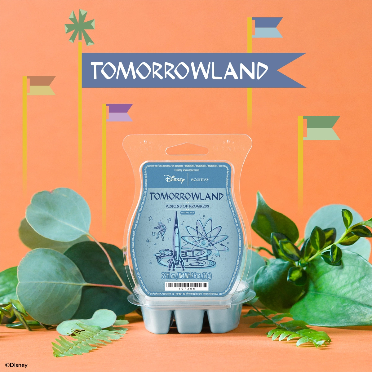 Scentsy wax melt bar in clear clamshell packaging with blue label featuring Tomorrowland imagery and "Visions of Progress" text, surrounded by green foliage and decorative flags against a coral background, the Walt Disney World - Scentsy Wax Collection