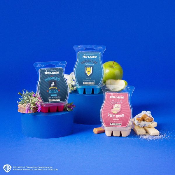 Ted Lasso Scentsy Bars in Biscuits with the Boss, Smells Like Potential and The Diamond Dogs, with green apple, lavender and shortbread on a blue backdrop