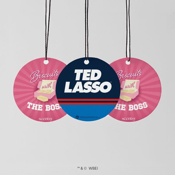 Three hanging round cards on black cords, two pink with a biscuit box design and one navy and blue Ted Lasso card, the Biscuits with the Boss Scent Circle 3-pack