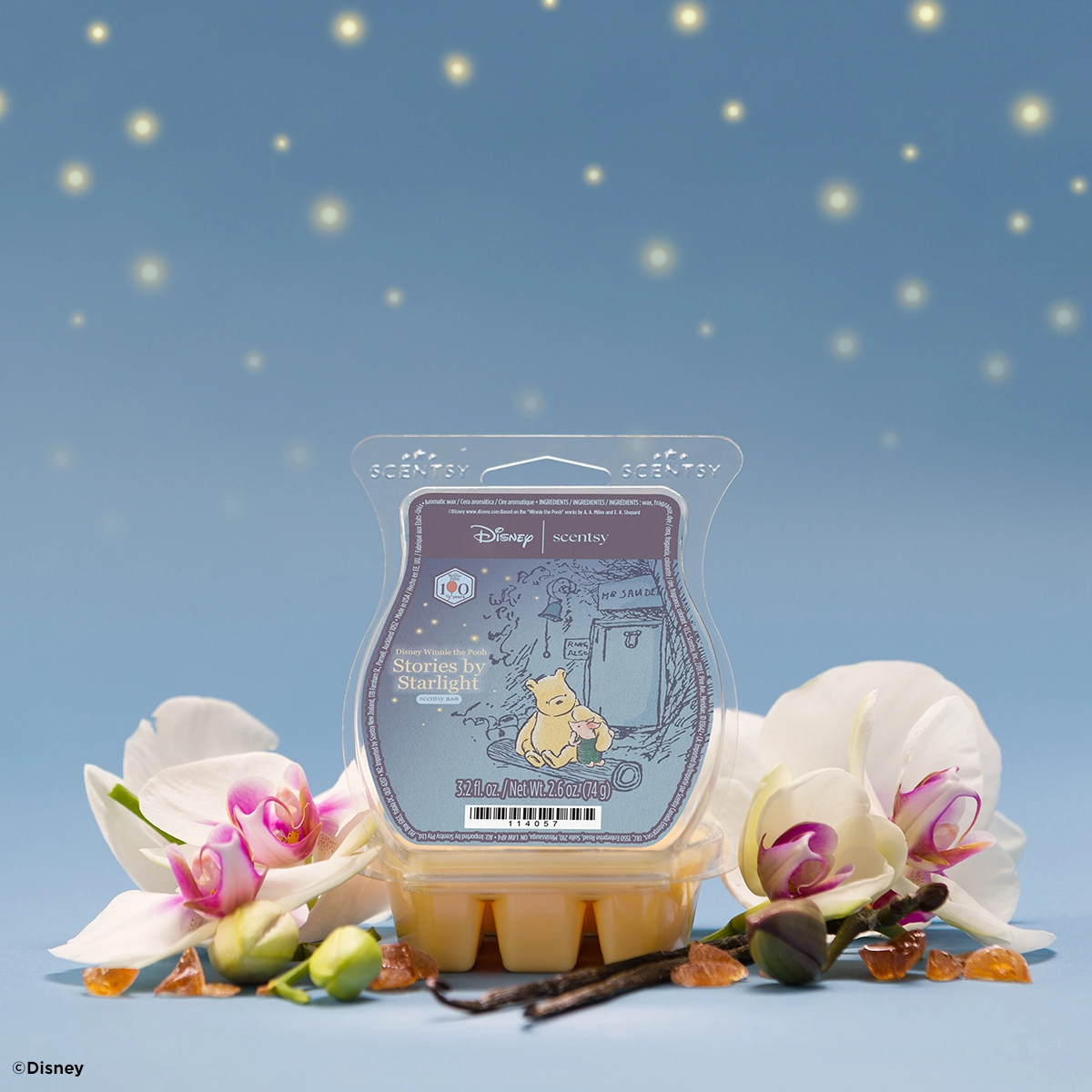 Pale yellow wax bar with a sketched Pooh and Piglet label, the Disney Winnie the Pooh: Stories by Starlight Scentsy Bar, amid orchids