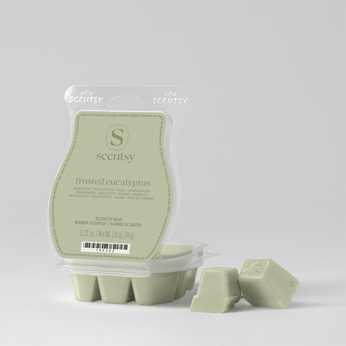 Sage green Scentsy Bar in a clear clamshell pack with two wax cubes broken off beside it, the Frosted Eucalyptus Scentsy Bar from the Alpine Holiday 5-pack