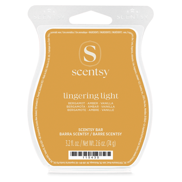 Mustard-yellow wax bar in a clear moulded clamshell with a white Scentsy logo, the Lingering Light (Mary) Scentsy Bar