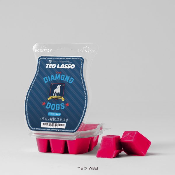 Pink wax cubes in a clear clamshell with a navy striped Ted Lasso label and greyhound crest, The Diamond Dogs Scentsy Bar, two cubes broken off beside it